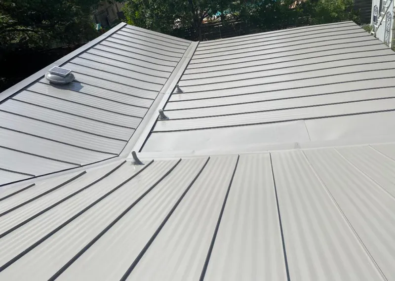 Solar attic fan installed on a metal roof for Roof Ventilation in Kissimmee